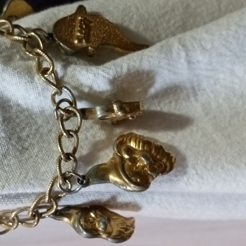 Vintage childs gold plated bracelet with the seven dwarves charms.
